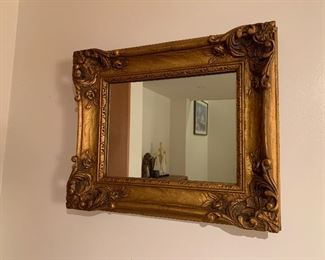 Large gold tone wall mirror