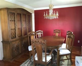 Dining set includes table, leaf, table pads, seating for 6 and china cabinet. 