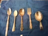 11. SILVER PLATE BABY SPOONS AND ONE FORK  FIRST ONE IS MARKED SOUTH SEA COMMUNITY, SECOND IS MARKED USV , THE NEXT 3 PIECES ARE MARKED 1881 ROGERS $4 EA.