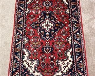 Red patterned area rug - 63"x 37"