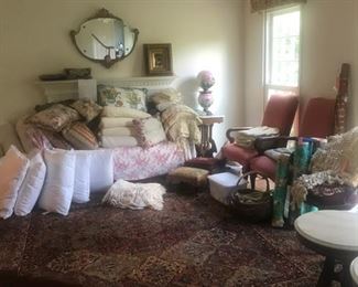 Linens, upholstered chairs, marble tables, hurricane lamp, mirror, oil painting, pillows and more