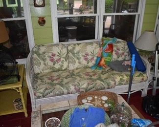 Great looking wicker furniture that is on sun porch - not out in weather.