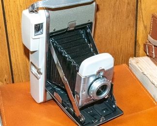 Three Polaroid cameras