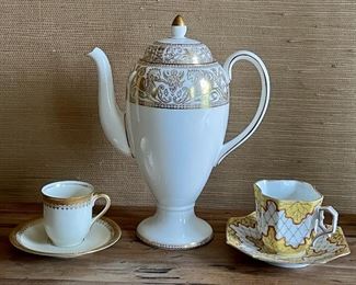 Item 78:  (2) Tea Cups (left & right):   $16                                                                                Item 79:  Wedgewood Gold Florentine W4219 Coffee Pot (middle):  $125