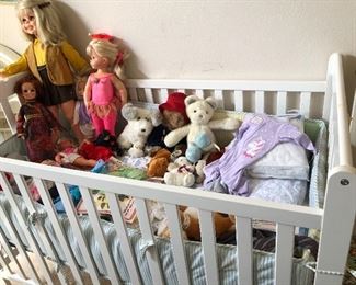 baby bed has filled up with mor goodies dolls from the 1960's