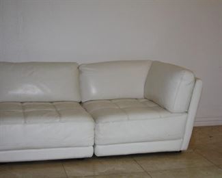 no 121 White leather Sectional L-Shaped sofa with ottoman - $895 