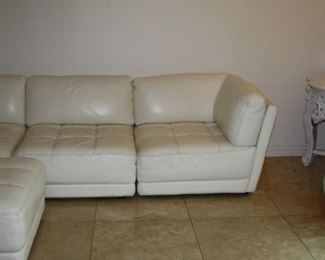 no 121 White leather Sectional L-Shaped sofa with ottoman - $895 
