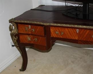 no 144. Large inlaid desk with ormolu brown leather top - 71' w, 35" d, 32" t - $2,250 