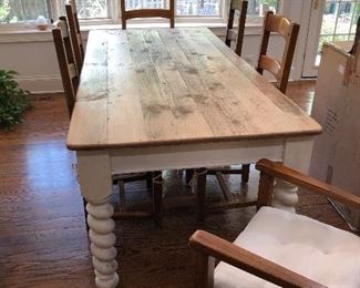 beautiful farmhouse table, white distressed base, natural wood plank top, 6 ladder back chairs with rush seats and thick white cushions - 2 arm, 4 side