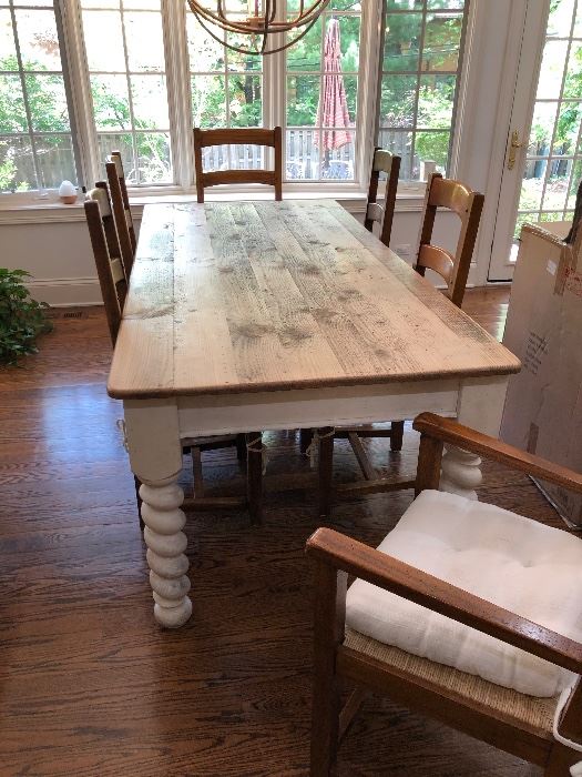 beautiful farmhouse table, white distressed base, natural wood plank top, 6 ladder back chairs with rush seats and thick white cushions - 2 arm, 4 side