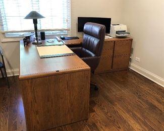 clean lined work from home Steelcase L desk with file cabinets and plenty of work space