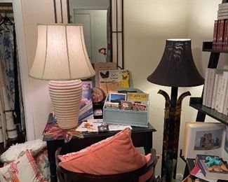 Black wood desk, round back chair, modern floor lamp, metal mirror, more cushions