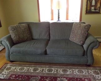 Living room Broyhill couch with brass tack buttons