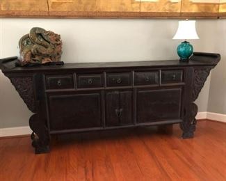 $1,500-Large Chinese Altar Table, late 19th-early 20th century.  Shows signs of age/use, most likely was a home altar table.  Heavy/substantial, carved side brackets, huge presence. Dragon carved corners. Size 8 1/2' x Depth 41" 