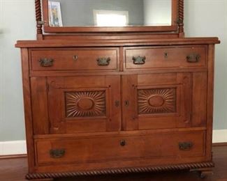 American Hutch built around 1900 in the Springfield MA area. Heavy/substantial, hand carved sunbursts on front doors. Still has original beveled glass mirror and original pulls. Drawers are dovetail construction. Price $375.00  Dimensions 4' wide x Depth 24", Height 37 and 1/2 ".