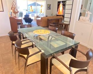 Beautiful adjustable glass table set, seats up to 8 people.