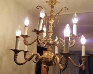 upstairs, smaller chandelier, metal and crystal (crystals NOT attached but we have them all in a bag).  Matches the one in dining room.
