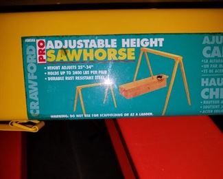 adjustable, collapsible, metal sawhorses.  7 of these, 5 never used