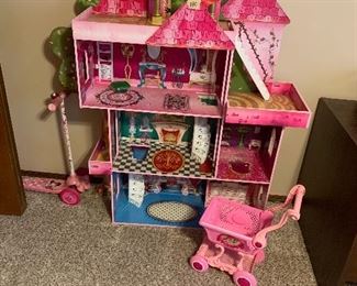 Doll house, child’s shopping cart and scooter