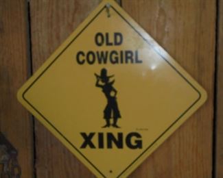 Vintage metal sign '"Old Cowgirl Xing'