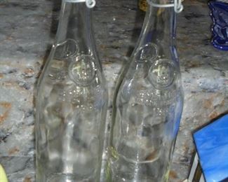 2 clear stoppered bottles