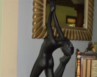 Nude holding ball lamp
