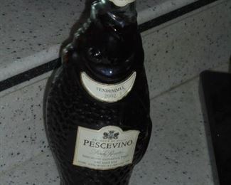 Unopened Vene-mmia 2002 Percevino rose table wine in fish bottle