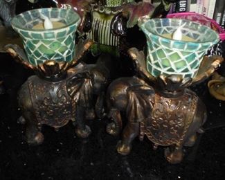 2 small cast elephant candle holders