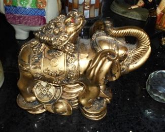 Small cast gold elephant w/frog on back