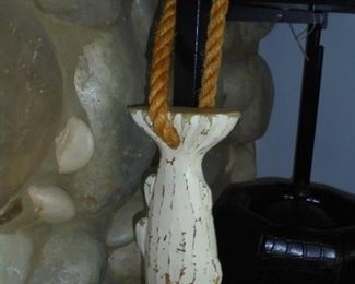 White wood fish on rope