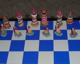 Blue & white chess board w/lighthouse's  and sail boats as pieces
