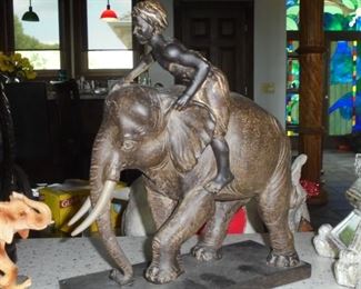 Brown cast elephant w/rider on top 
