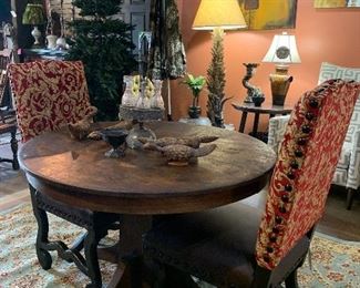 round oak pedestal table, paired with two chairs but any chairs would look great with this table!