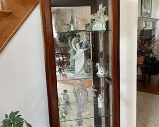 . . . a beautiful curio cabinet with Lladros among other nice crystal accents
