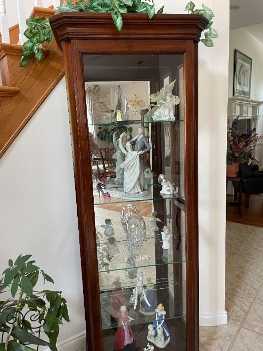 . . . a beautiful curio cabinet with Lladros among other nice crystal accents