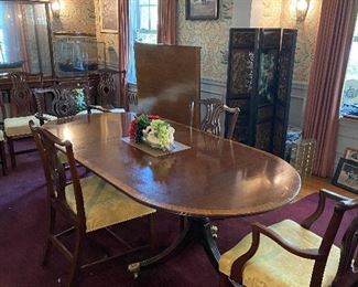 Antique Chairs. Large Banquet three part table. The Inlaid Table has leaves or there is a tip table that can be moved and inserted in the middle to create a banquet size table.  Must be seen!!