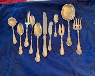 Sterling.  Set for 8 with extra pieces