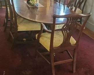 Set of seven antique Chippendale dining chairs. Two arms, five sides. 