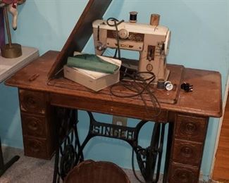 antique sewing stand with newer sewing machine installed