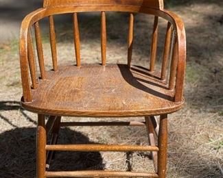 One of four vintage captain's chairs