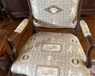 Pair of French Provincial chairs covered in a beautiful toile fabric.