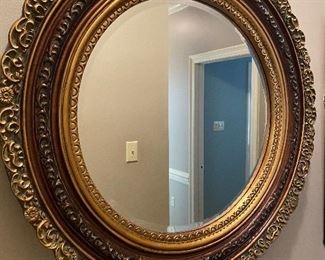 Large round mirror with gold frame