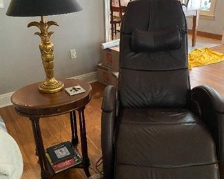 Reclining leather chair, side table and lamp