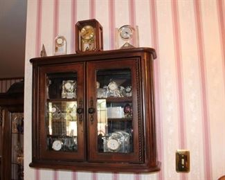 Vintage cabinet with Waterford crystal and clocks