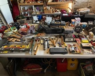 hand tools everywhere, hammers, levels, socket sets