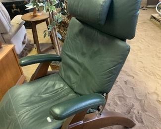 The name of this super comfy chair is: "Perfect Chair" Zero Gravity Recliner. Green Leather & Walnut Legs. GREAT condition. Do some research on these .... they are so comfortable!!
