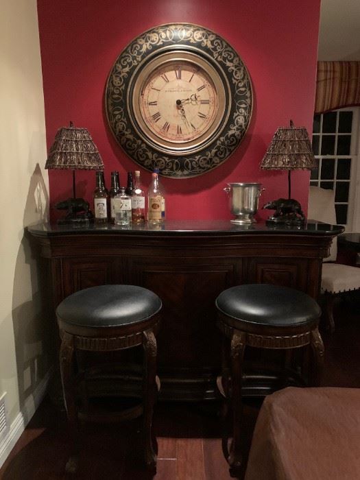Bar and Stools Set $750.00  Clock $50.00. Lamps also available