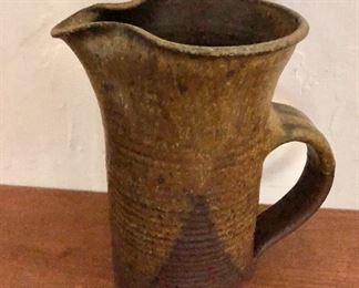 $50 Signed stoneware pitcher with molded lip.  8" H, 5" diam. 
