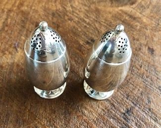$175 Pair Georg Jensen Cactus pattern sterling silver salt and pepper shakers. Each 2.75" H.