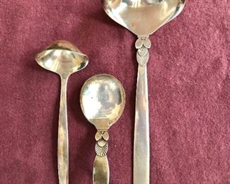 Georg Jensen Cactus (Kaktus) pattern sterling silver gravy ladles and baby spoon.  $150 Ladle on right 7.25" L and on left $75 5.25" L. $60 Baby spoon 3.5" L .SOLD 